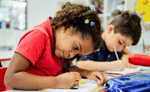 Two kindergarten students writing